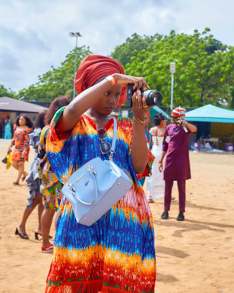 A camera girl wearing Ankara dress