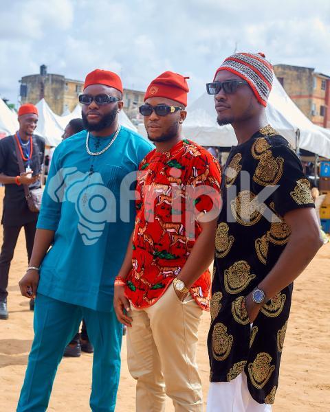 Boys wearing sunglasses with traditional outfits