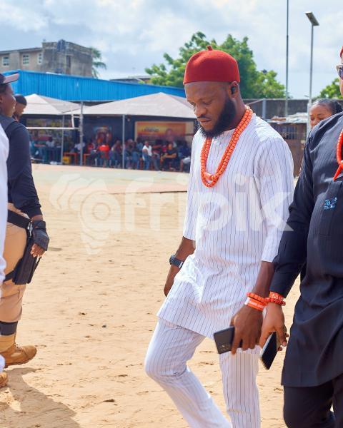 A Boy wearing a kaftan walking