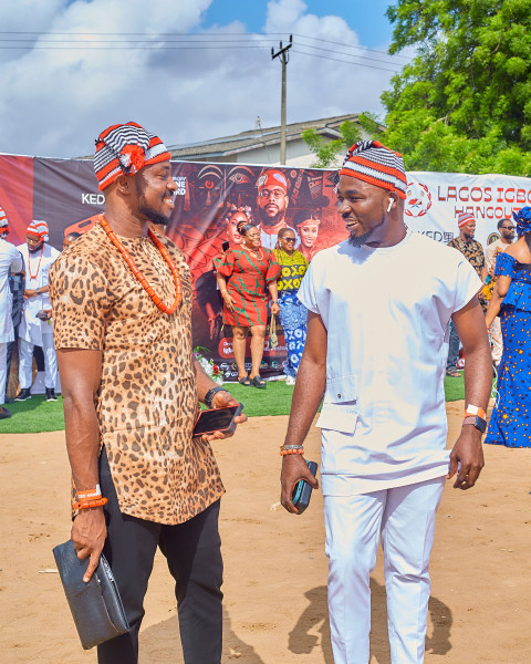 Two men cheerfully discussing.