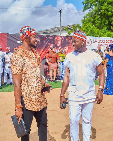 Two men cheerfully discussing.