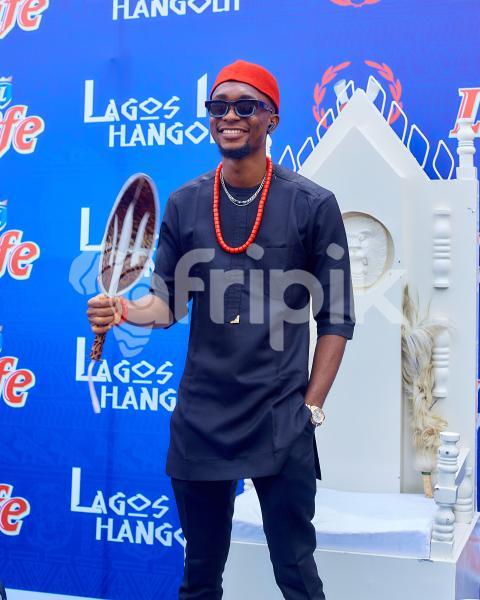 A boy wearing a traditional outfit standing