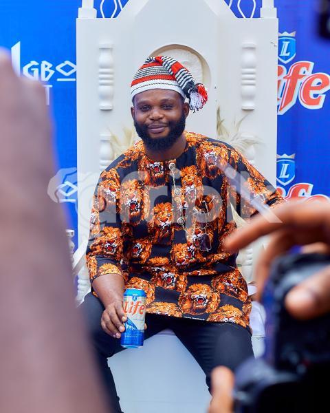 Boy sitting on a chair wearing cultural attire 2