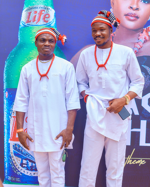 Two boys wearing a white kaftan