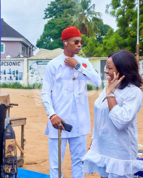 A boy wearing a white kaftan