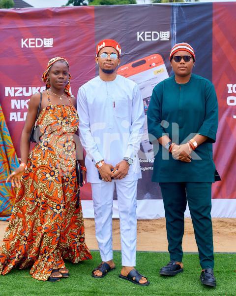 People posing in their traditional outfits