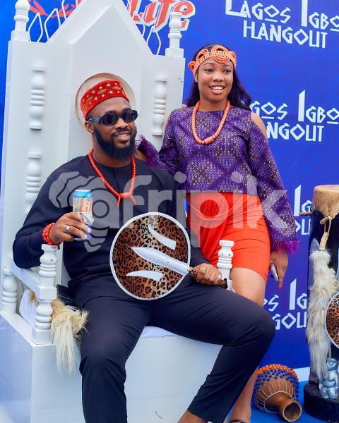 A girl standing beside a boy sitting 3