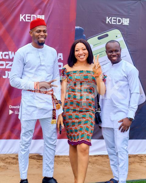 People smiling while posing for a photoshoot