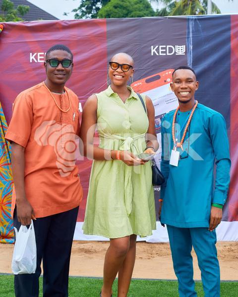 People posing in traditional outfits