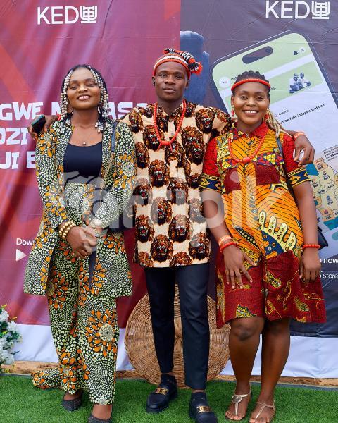 People posing in their cultural outfits