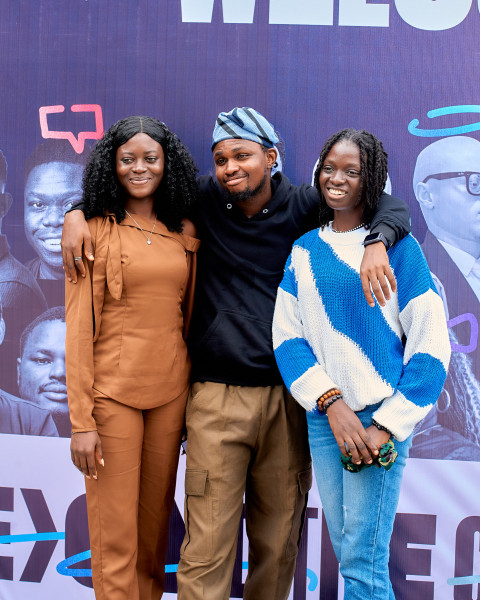 A Boy posing with two ladies 1