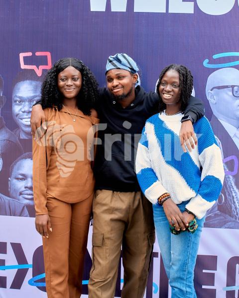 A Boy posing with two ladies 1