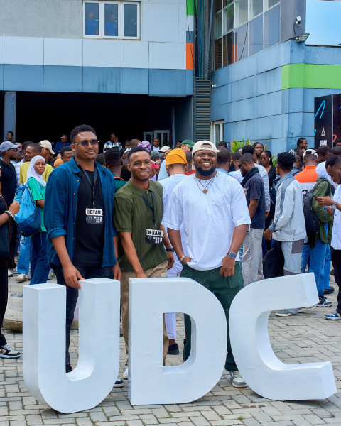 Some boys taking photos at UDC 2024