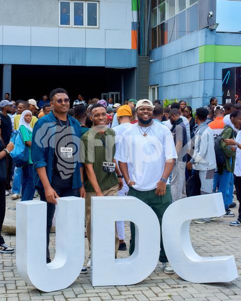 Some boys taking photos at UDC 2024