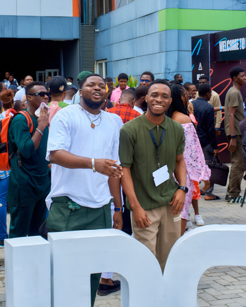 Two boys posing for a photo at UDC 2024