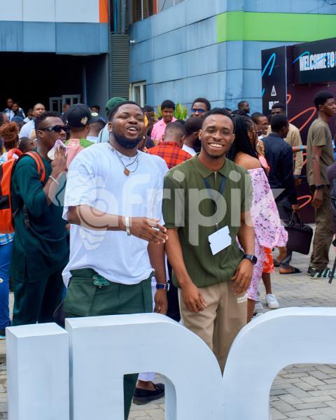 Two boys posing for a photo at UDC 2024