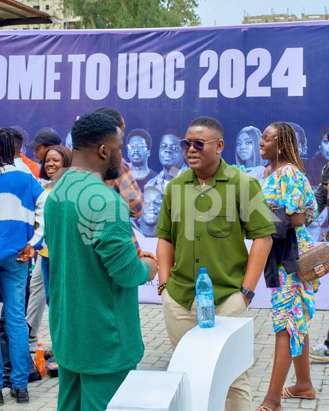 two boys talking outside at UDC 2024