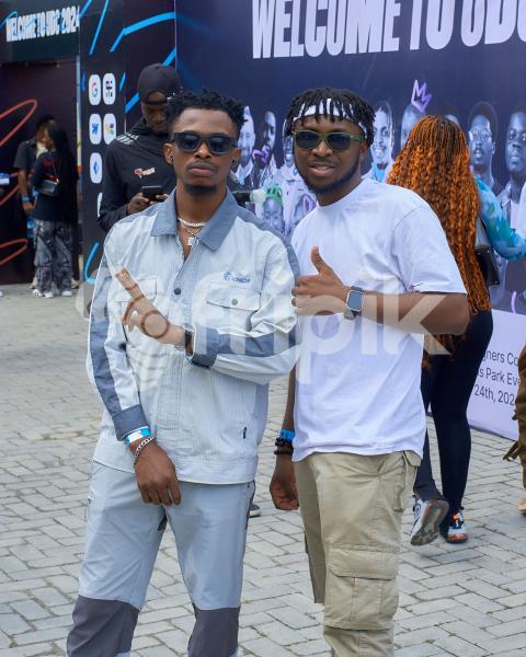 Tow boys posing for a photo