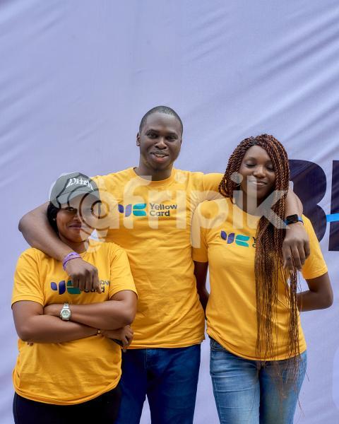 A boy posing with two ladies