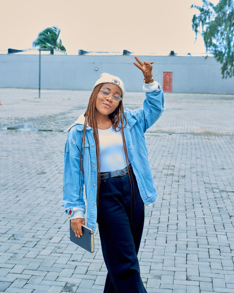 A beautiful girl on blue jacket