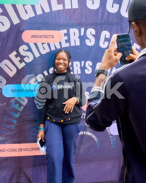 Attendee taking photo at photo booth