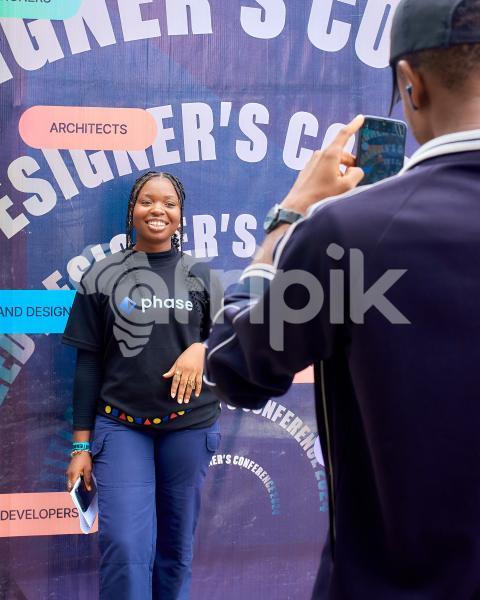 Attendee taking photo at photo booth 1