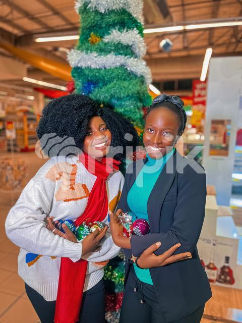 2 friends with christmas balls