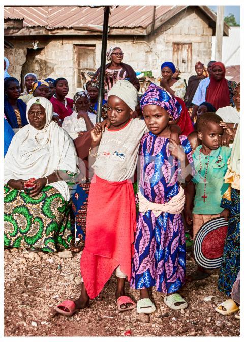 Children holding each other