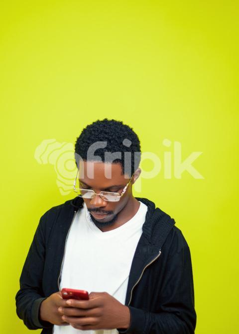 Boy pressing his phone