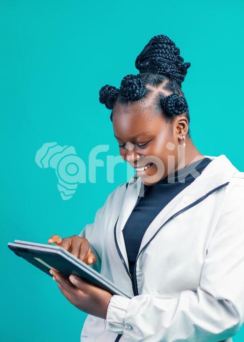 Girl using her tab happily