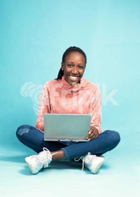 Girl sitting on the floor with her laptop