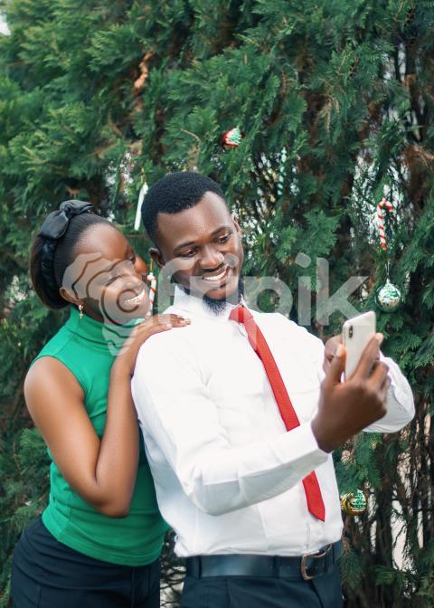 Girl and boy looking at a phone