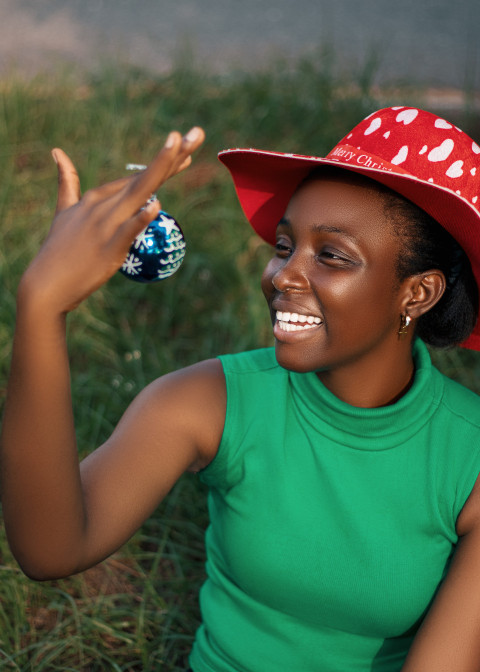 Girl looking at a christmas ball