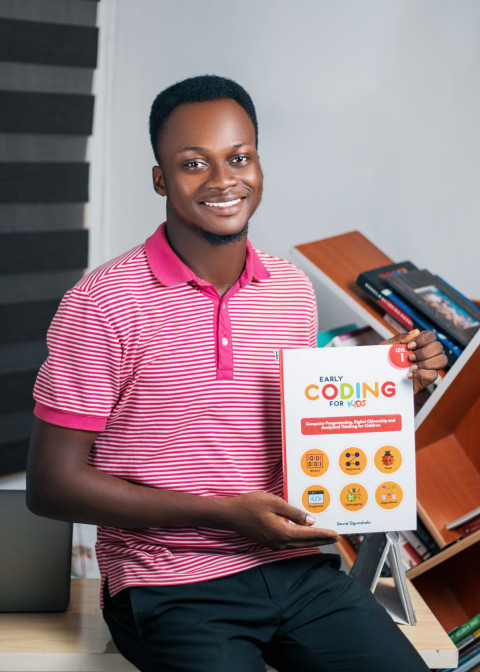 Teacher with coding textbook