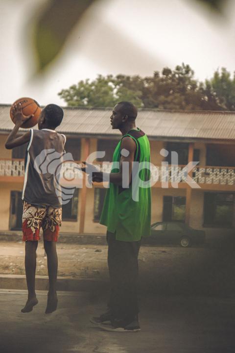 Kids  playing basketball outside