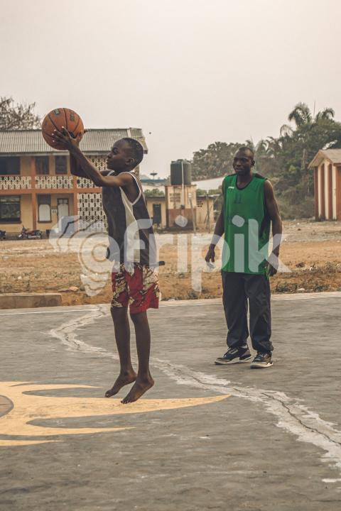 Coach playing basketball