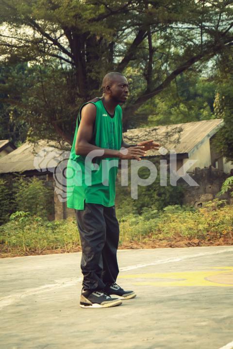 Baketball coach playing basketball