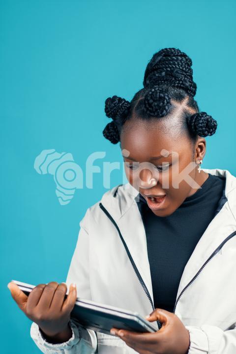 Girl looking at her laptop surprised