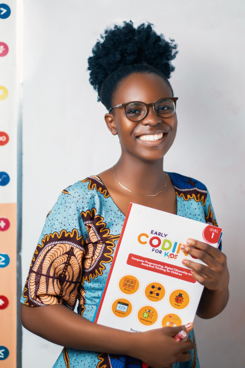 Teacher with coding book