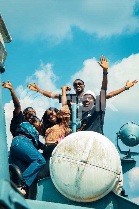 Excited friends with outstretched hands