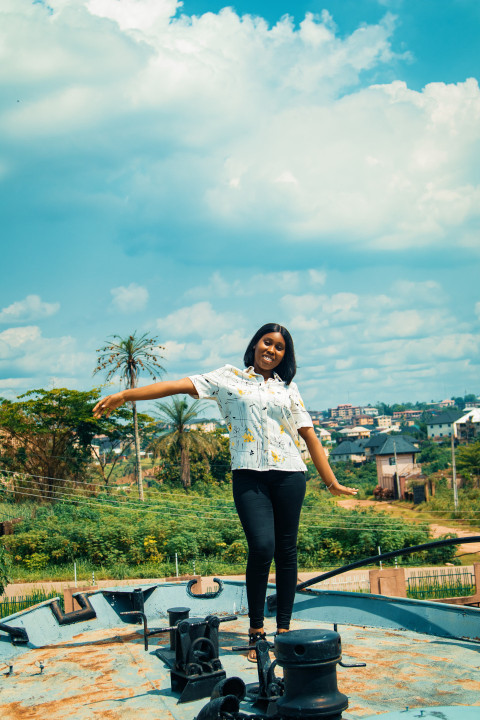 Pretty girl standing on a war ship