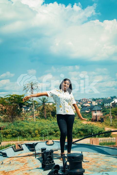 Pretty girl standing on a war ship