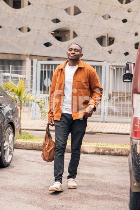Boy standing in front of Stadium