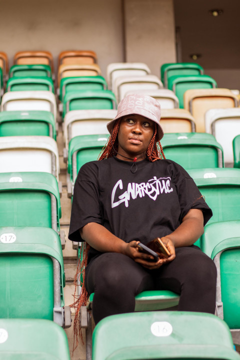 Girl sitting in stadium