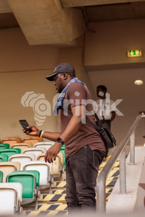 boy standing with phone