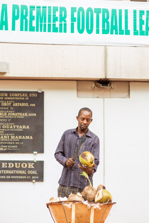 Man cutting coconut