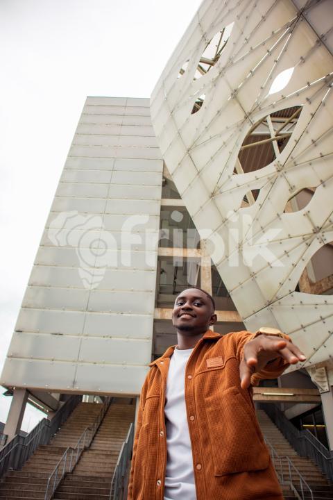 Boy in front of stadium