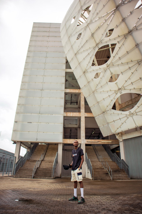 Boy standing in front of stadium 1