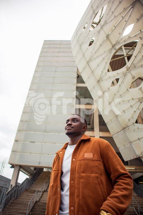 Boy in front of stadium