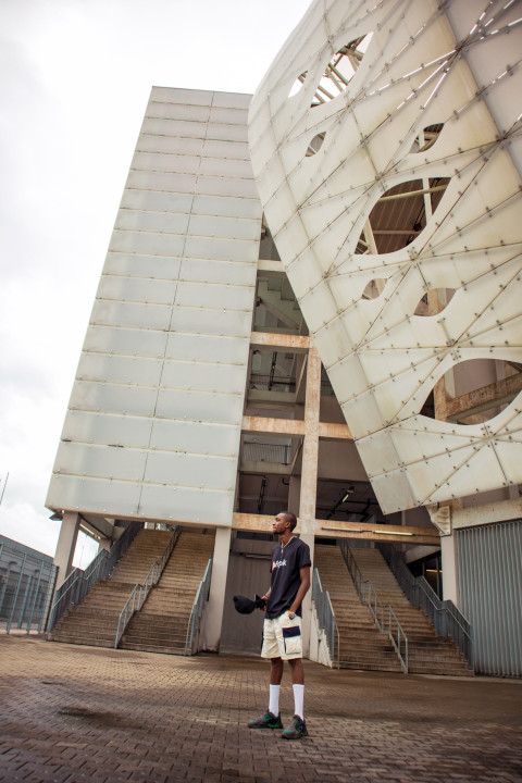 Boy standing in front of stadium 2